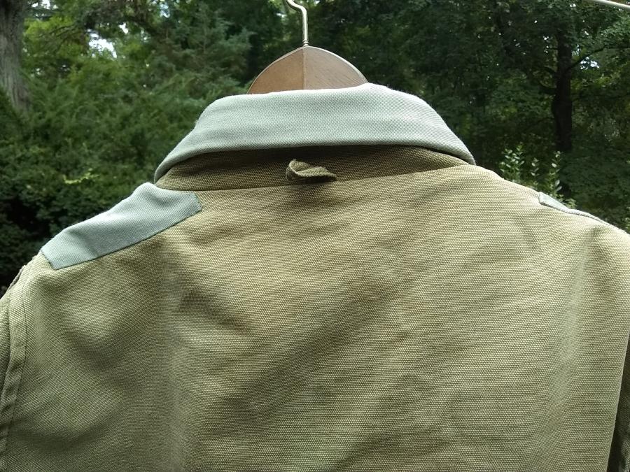 closeup back view of collar and shoulder patches on Carhartt jacket