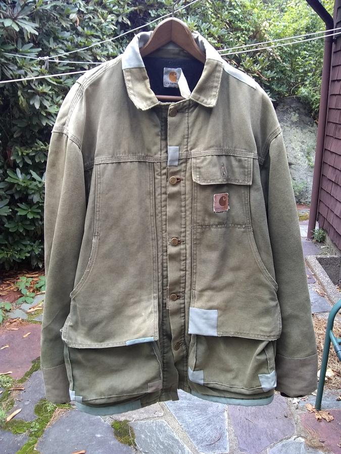 patched Carhartt jacket on closeline, front view