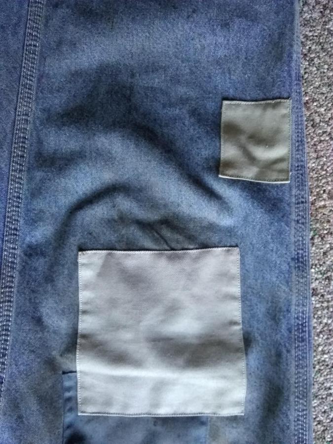 closeup of patches on blue jeans