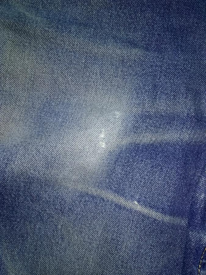 closeup of hole in left side of jeans