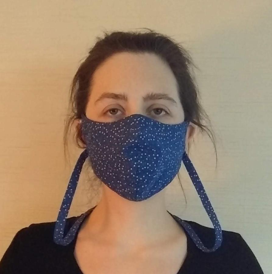 woman wearing fitted face mask with cloth neck cord, front view