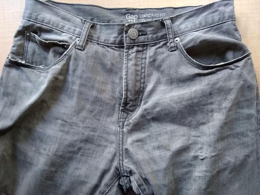 front top view of jeans with holes