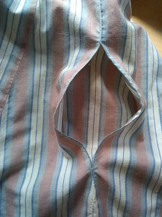 closeup of pocket and pocket lining in striped woven cotton shirt