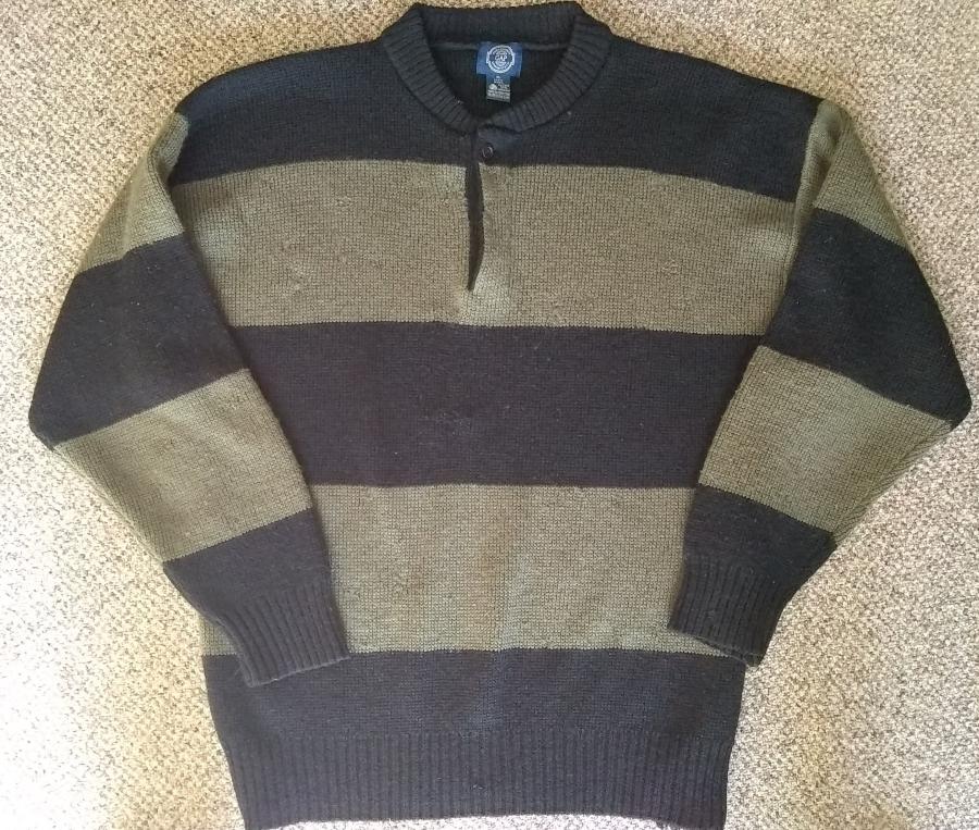 front view of a bulky sweater with wide olive and black stripes