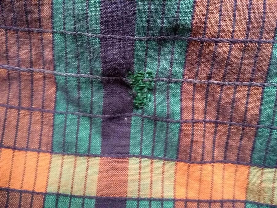 plaidish fabric with green darn