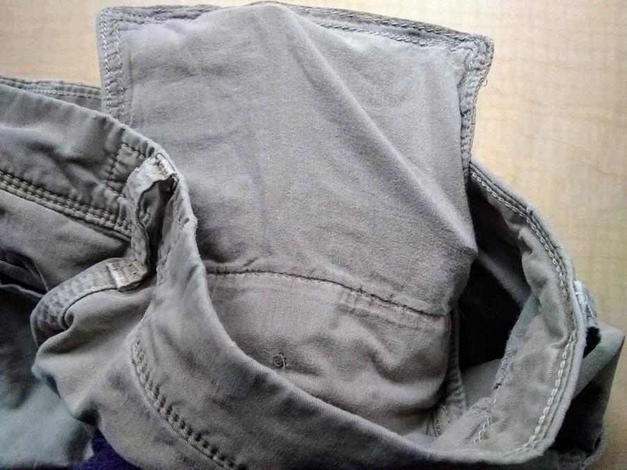 Waist/pocket of khaki pants, with invisible hand inside pocket to show that it does not have a hole in it (this makes more sense in context of the "before" picture)