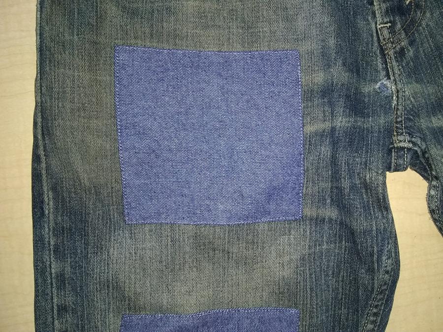 closeup of jeans leg with front patch