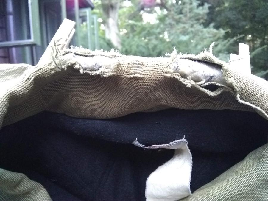 closeup of the torn collar of the jacket