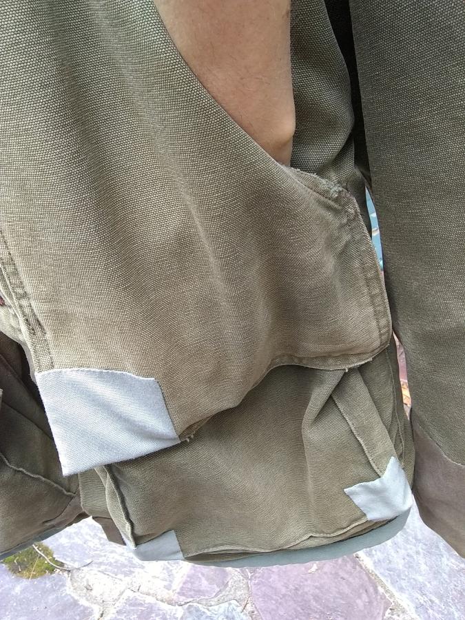 hand inside pocket of a Carhartt jacket to show that there is no hole anymore