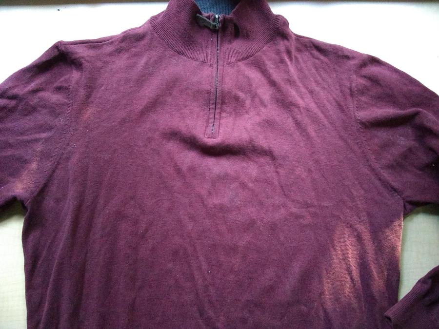 front of maroon sweater showing that there are no longer holes in armpits