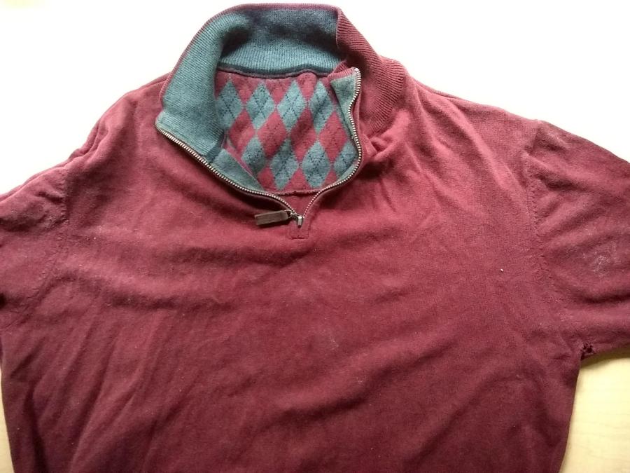 front of maroon sweater showing hole in armpit