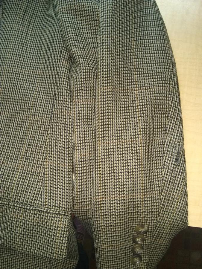 sleeve of sport coat with small rip