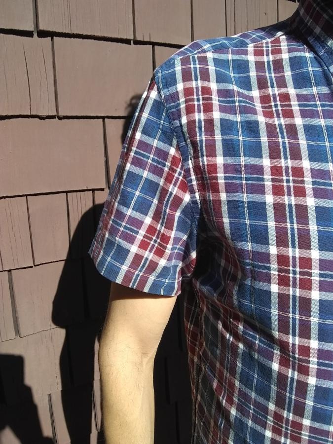 closeup of short sleeve plaid shirt showing sleeve