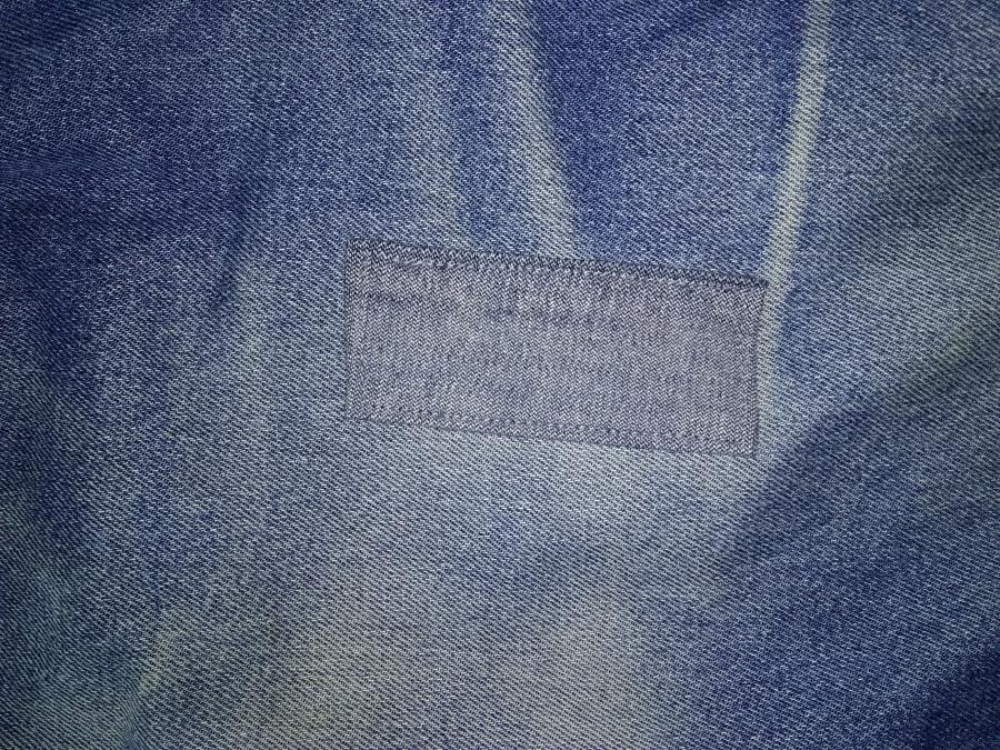 closeup of left side of jeans with patch