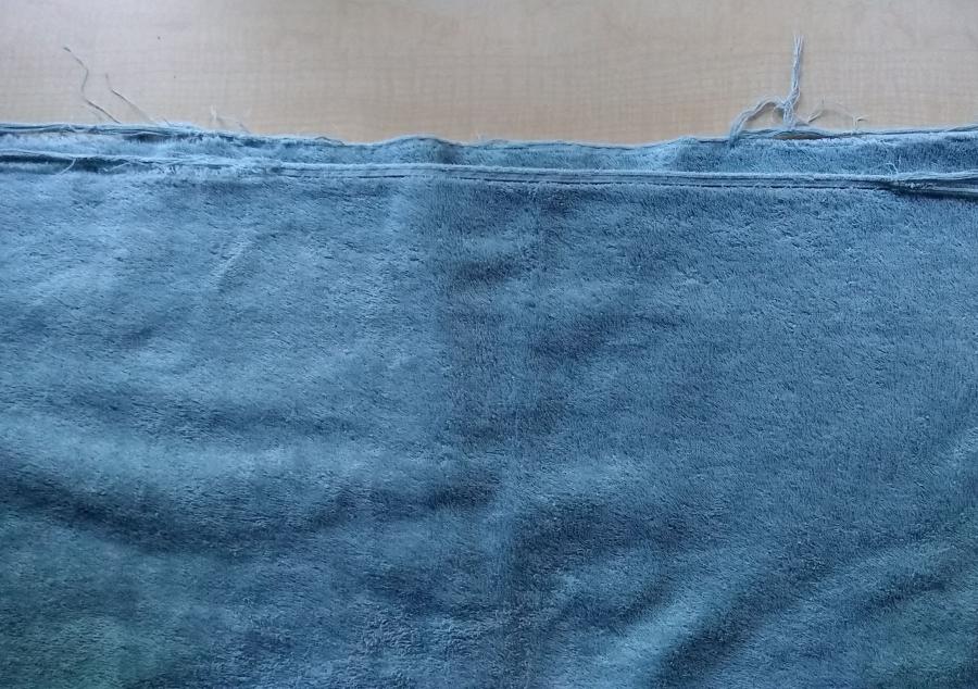 Blue towel with frayed edges