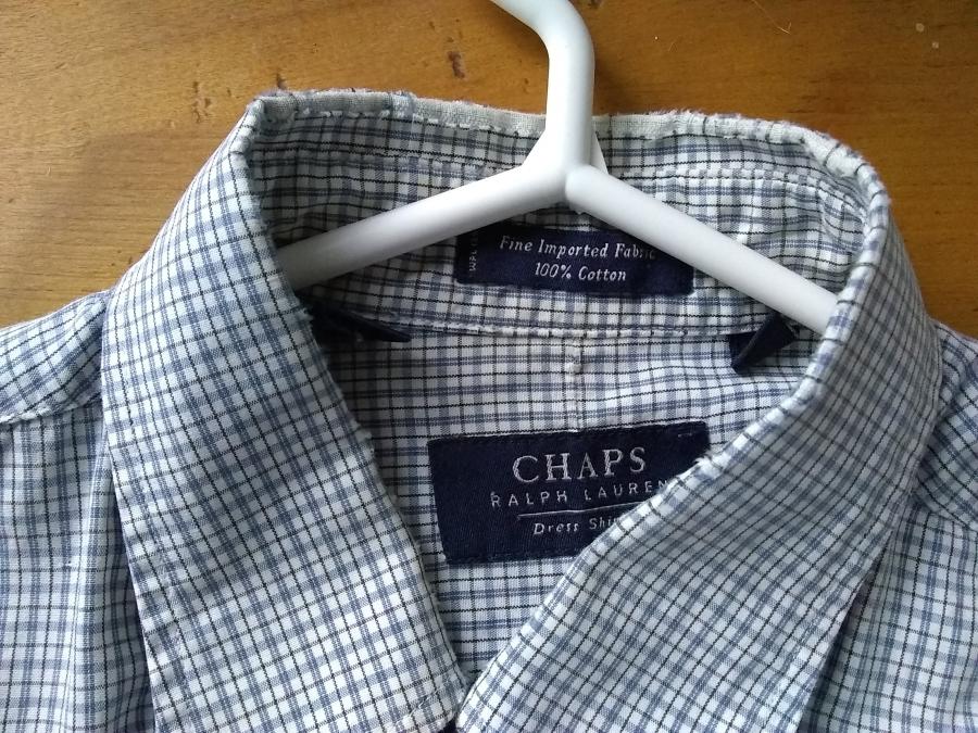 button down dress shirt in small white/blue plaid, front view of just the collar, showing worn fabric at the fold of the collar