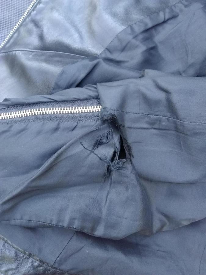 hole in the lining of jacket at the sleeve zipper